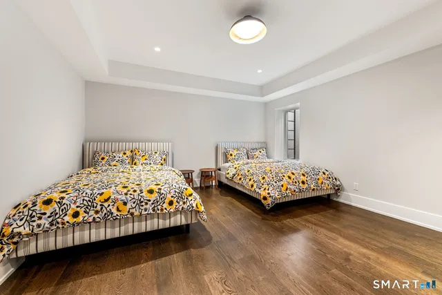 a bedroom with a bed and a night stand