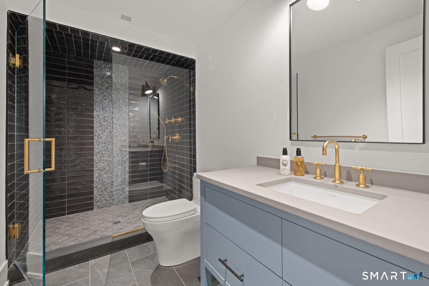 19 Beachside Common Westport, CT 06880 - Photo 33 of 40 a bathroom with a sink a toilet and shower