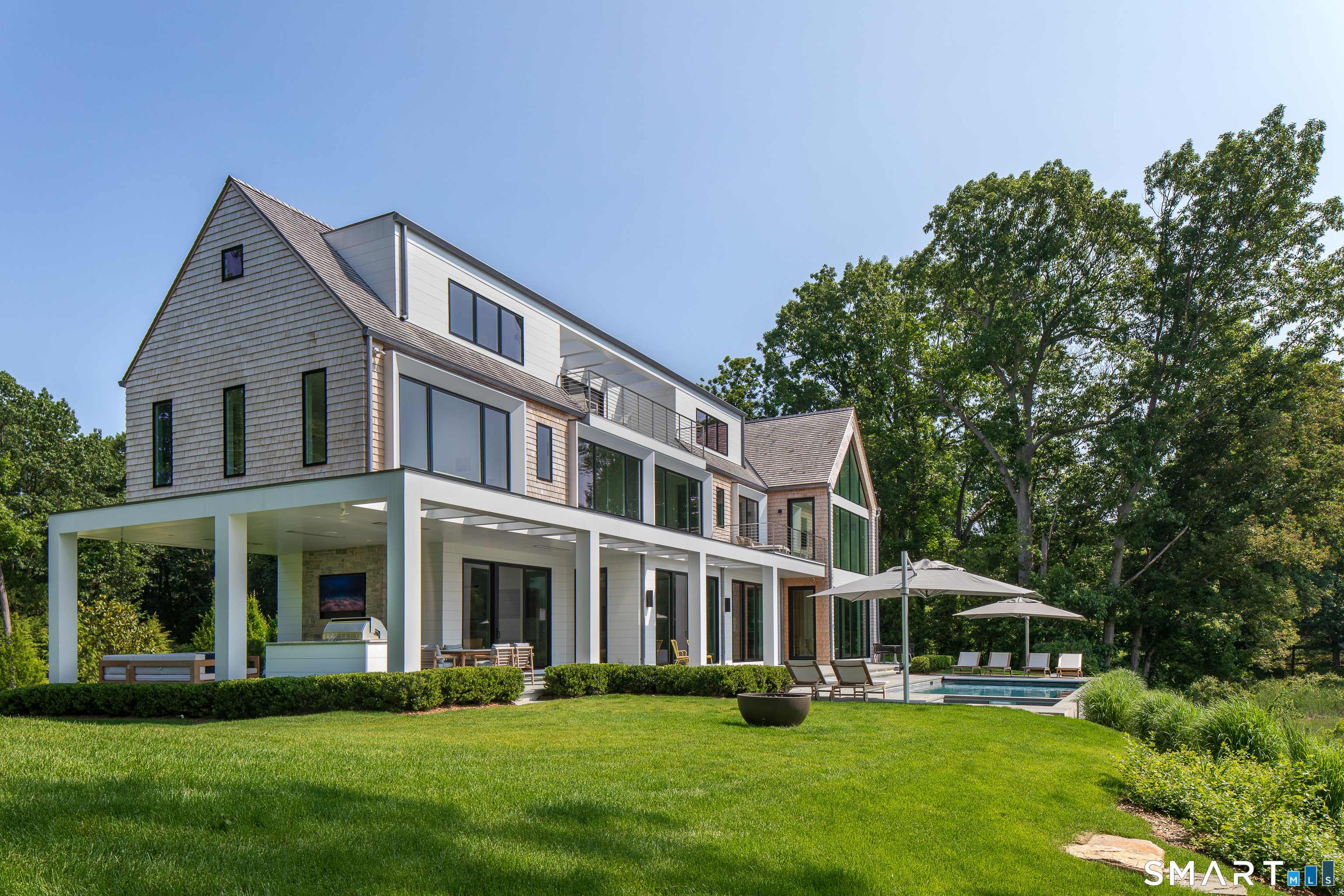 19 Beachside Common Westport, CT 06880 - Photo 36 of 40 a front view of a house with a yard