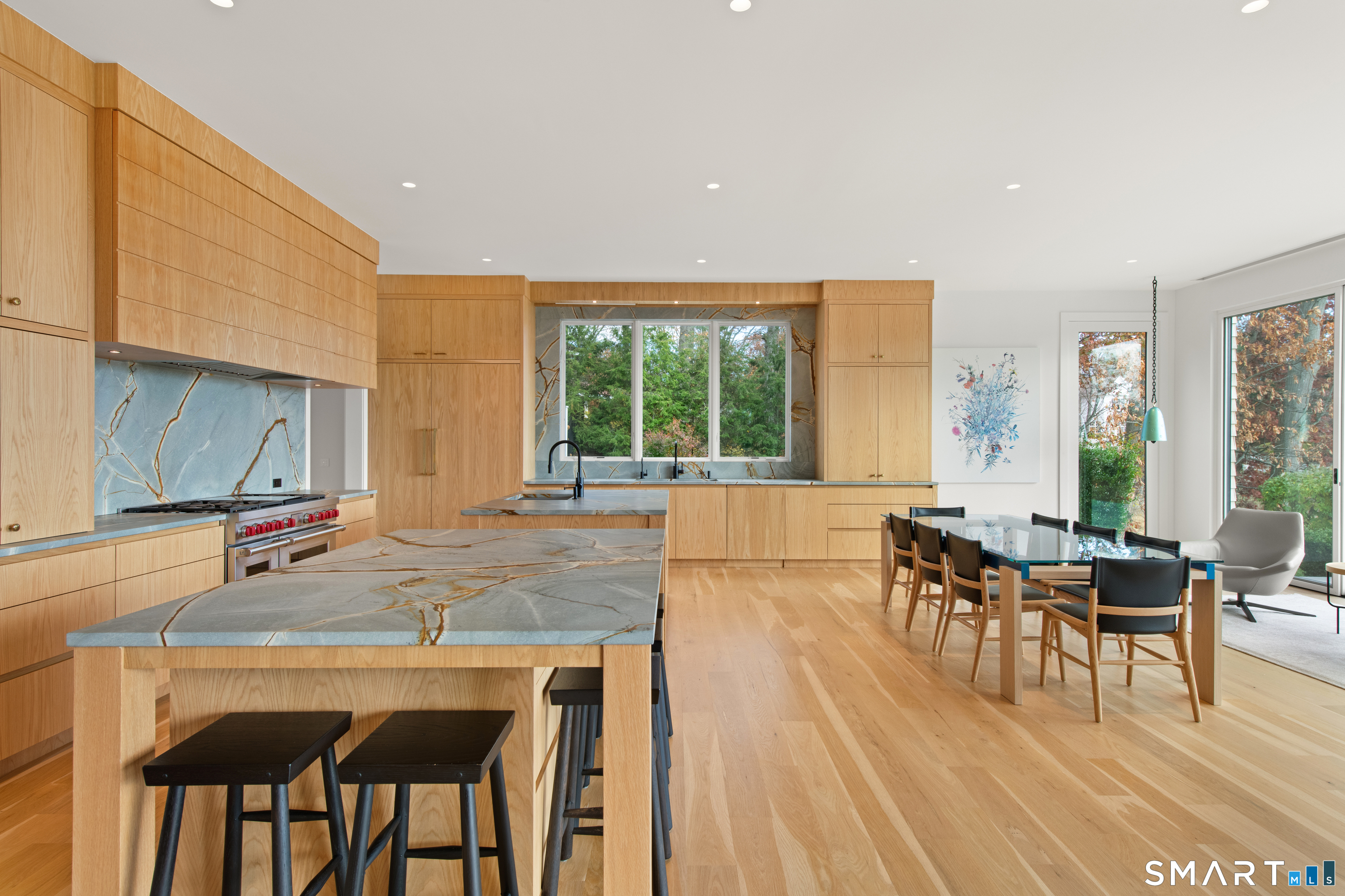 19 Beachside Common Westport, CT 06880 - Photo 7 of 40 a living room with furniture a dining table and a large window