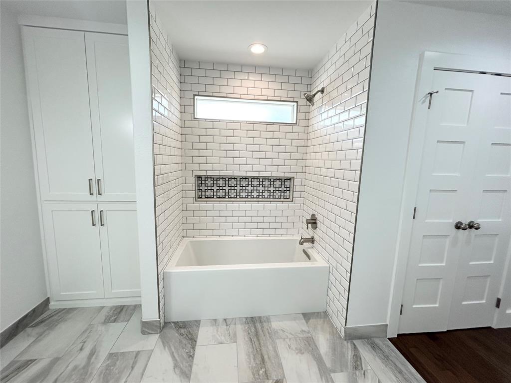 102 Colorado Street Sulphur Springs, TX 75482 - Photo 14 of 25 Custom tiled shower/tub combo and built in