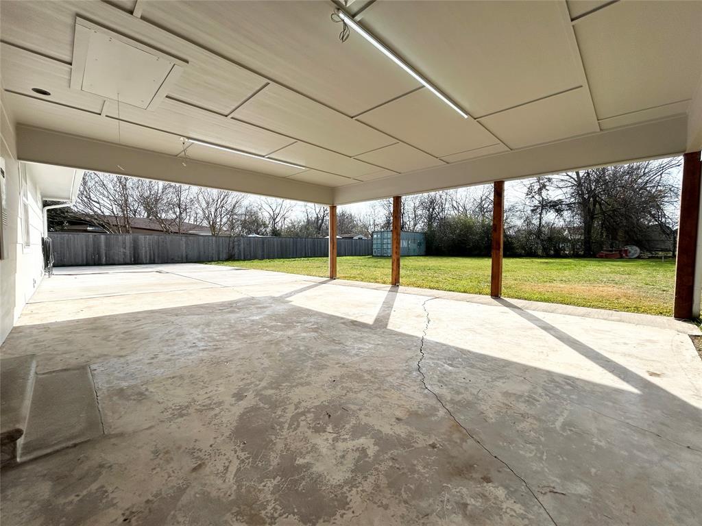 102 Colorado Street Sulphur Springs, TX 75482 - Photo 22 of 25 Spacious carport for covered parking or doubling as a large covered patio