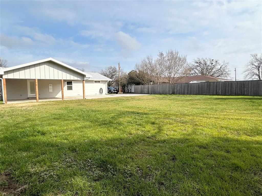 102 Colorado Street Sulphur Springs, TX 75482 - Photo 23 of 25 Grassed backyard. Fenced on 3 sides.