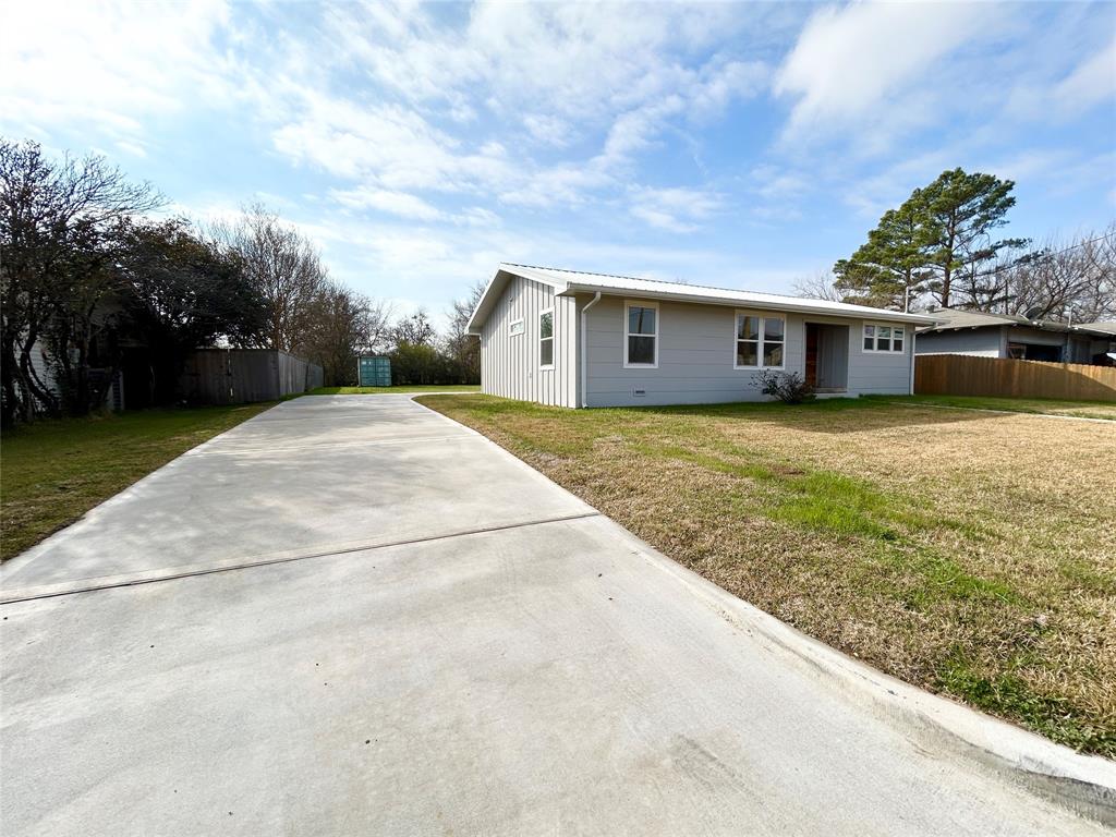 102 Colorado Street Sulphur Springs, TX 75482 - Photo 24 of 25 Long concrete drive with rear parking for privacy.