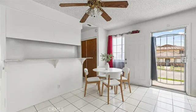 a view of a dining room with furniture and window