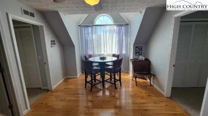 412 Mulberry Mountain Road Boone, NC 28607 - Photo 16 of 31 a view of a dining room with furniture and window