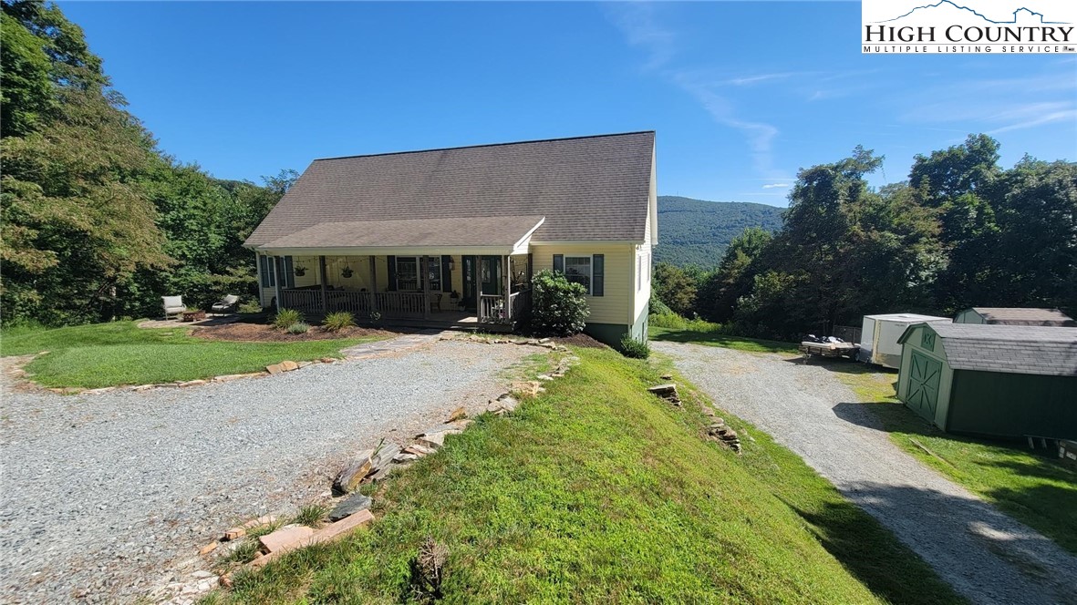 412 Mulberry Mountain Road Boone, NC 28607 - Photo 30 of 31 a view of a house with a yard