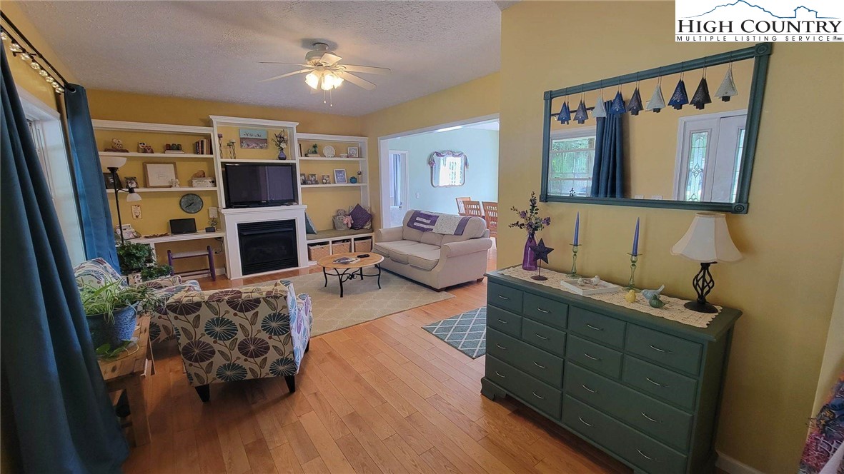 412 Mulberry Mountain Road Boone, NC 28607 - Photo 3 of 31 a living room with furniture and a flat screen tv
