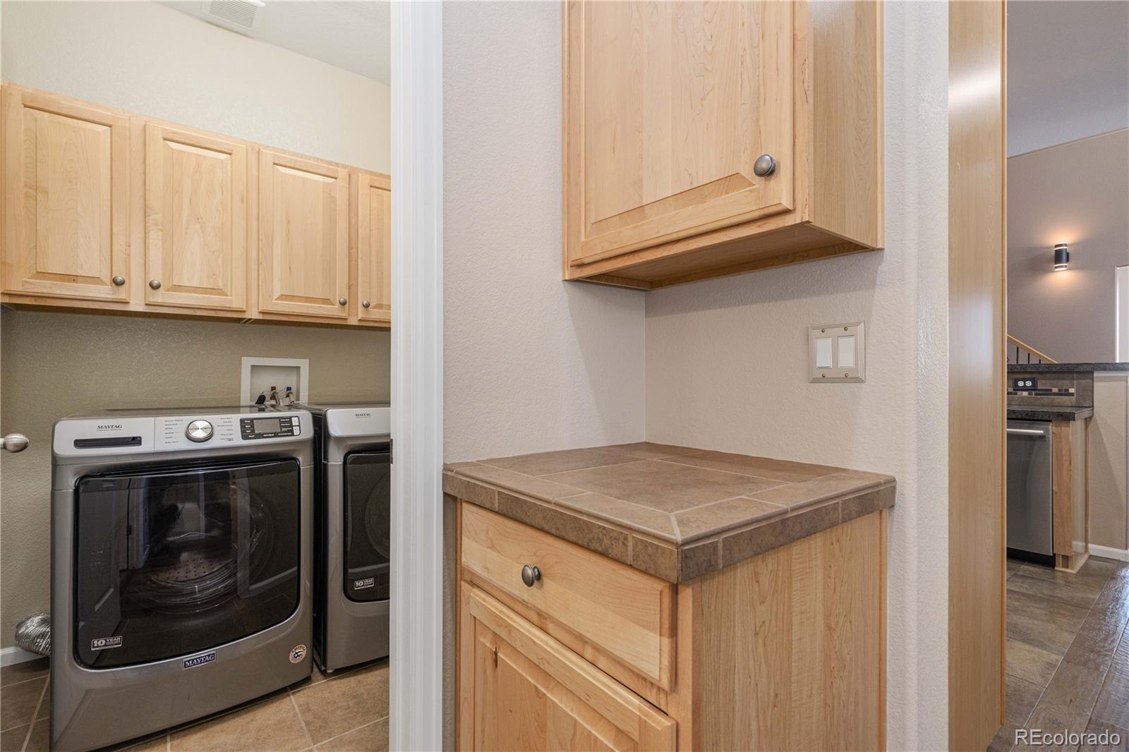 3301 Cascina Circle, Unit C Highlands Ranch, CO 80126 - Photo 23 of 40 a utility room with dryer and washer