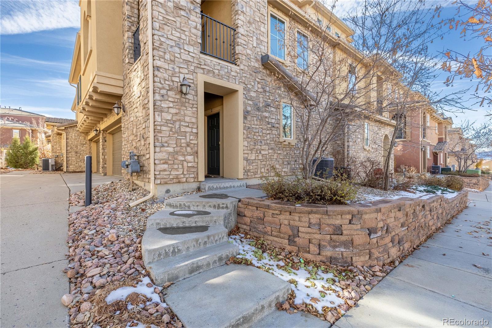 3301 Cascina Circle, Unit C Highlands Ranch, CO 80126 - Photo 3 of 40 a front view of a house with outdoor area
