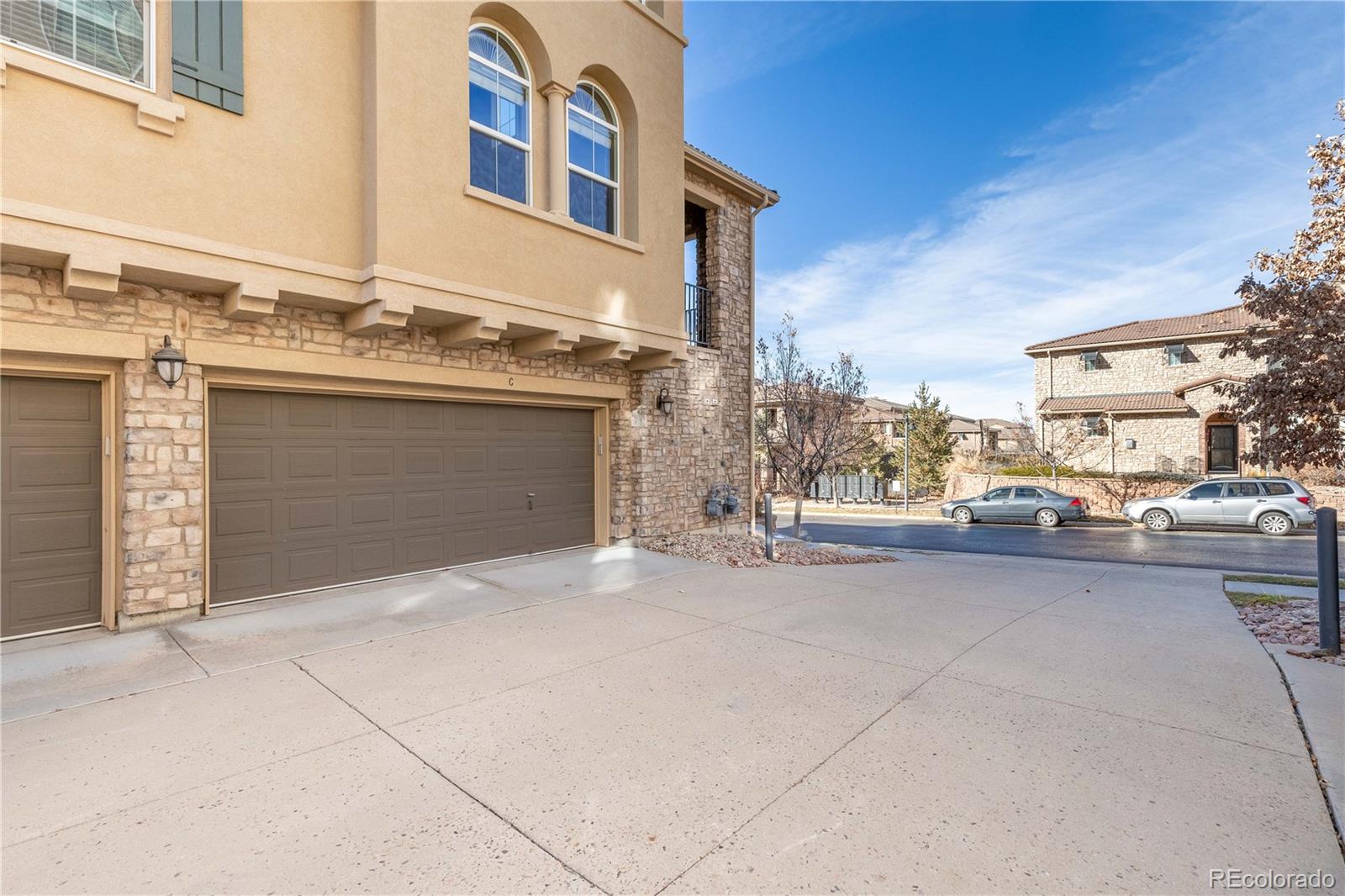 3301 Cascina Circle, Unit C Highlands Ranch, CO 80126 - Photo 34 of 40 a view of a parking space and a garage