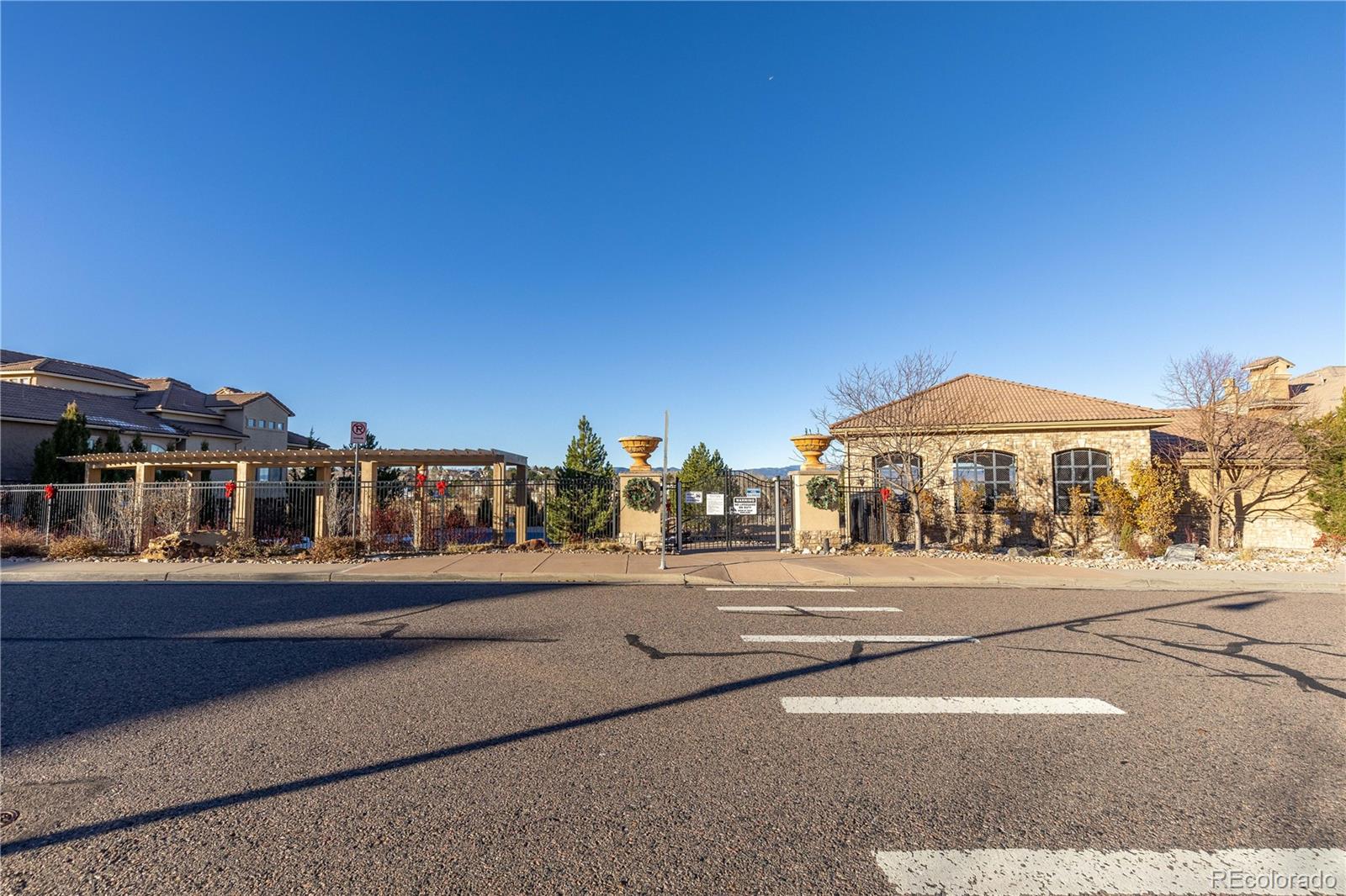 3301 Cascina Circle, Unit C Highlands Ranch, CO 80126 - Photo 36 of 40 a street view with tall buildings and a street