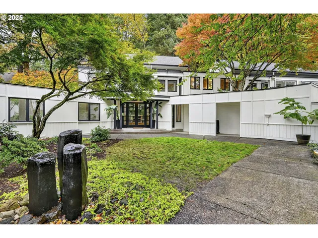 a front view of a house with garden
