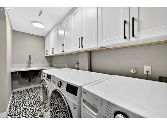 a view of kitchen with cabinets