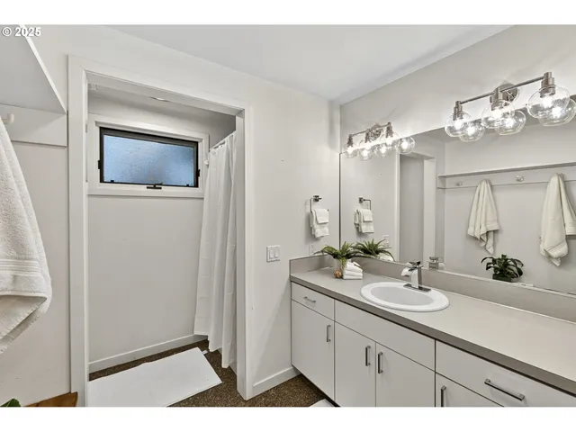 a bathroom with a double vanity sink and mirror