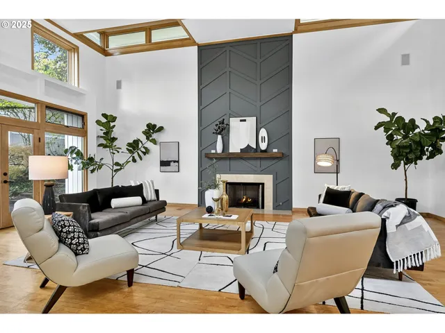 a living room with furniture a fireplace and a potted plant