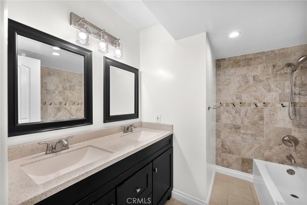 5251 Hamer Lane Placentia, CA 92870 - Photo 15 of 38 a bathroom with a tub a sink and mirror