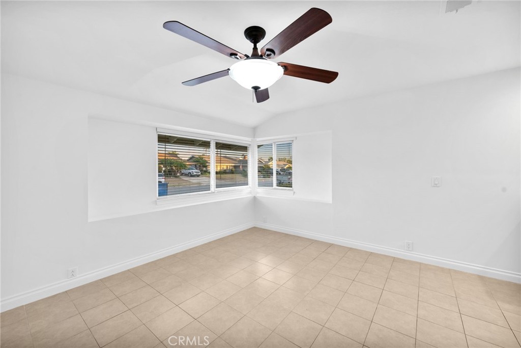 5251 Hamer Lane Placentia, CA 92870 - Photo 20 of 38 an empty room with windows and ceiling fan