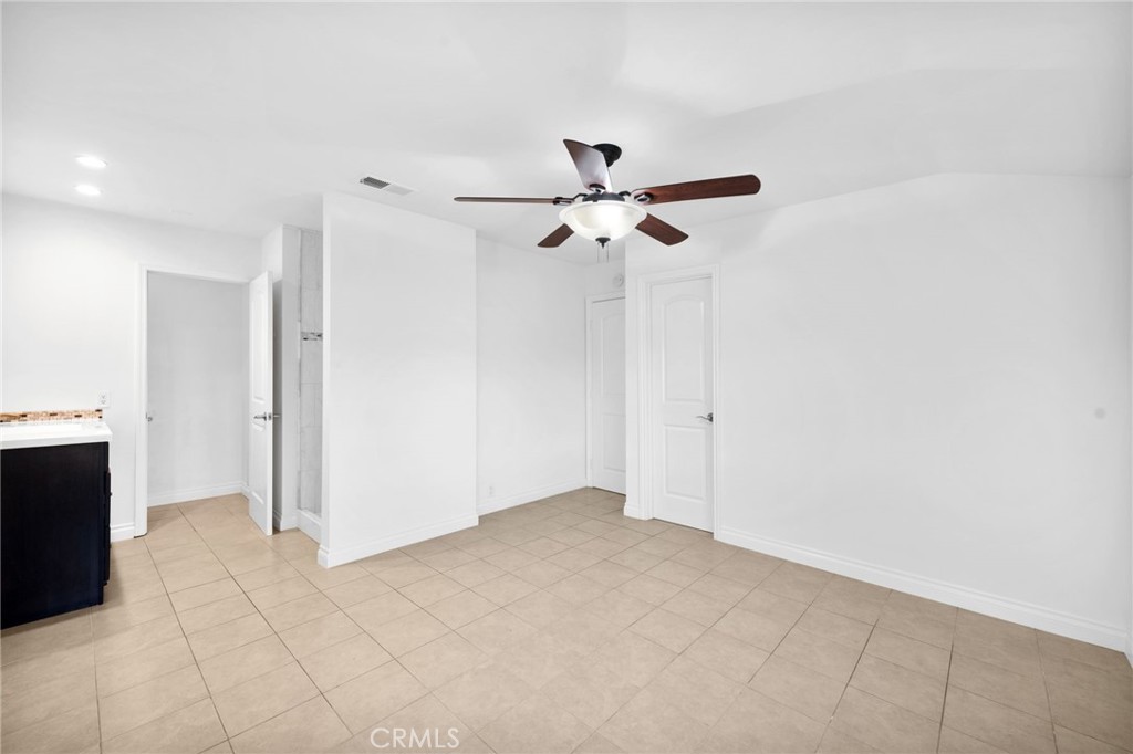 5251 Hamer Lane Placentia, CA 92870 - Photo 21 of 38 an empty room with closet and a ceiling fan