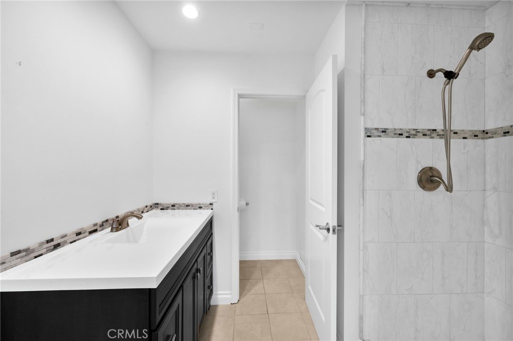 5251 Hamer Lane Placentia, CA 92870 - Photo 23 of 38 a bathroom with a sink and a mirror