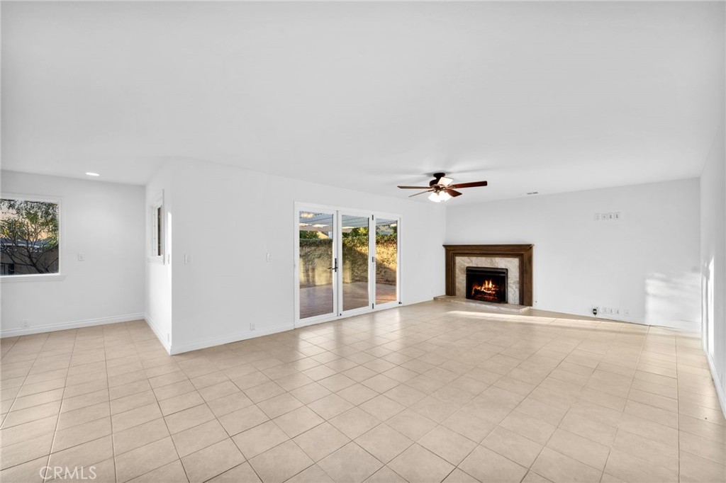 5251 Hamer Lane Placentia, CA 92870 - Photo 4 of 38 an empty room with windows and fireplace