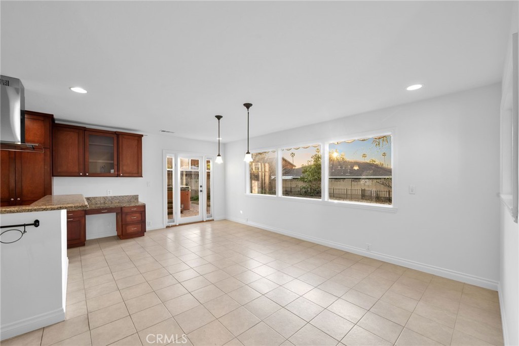 5251 Hamer Lane Placentia, CA 92870 - Photo 6 of 38 a large kitchen with stainless steel appliances a large counter top and a stove