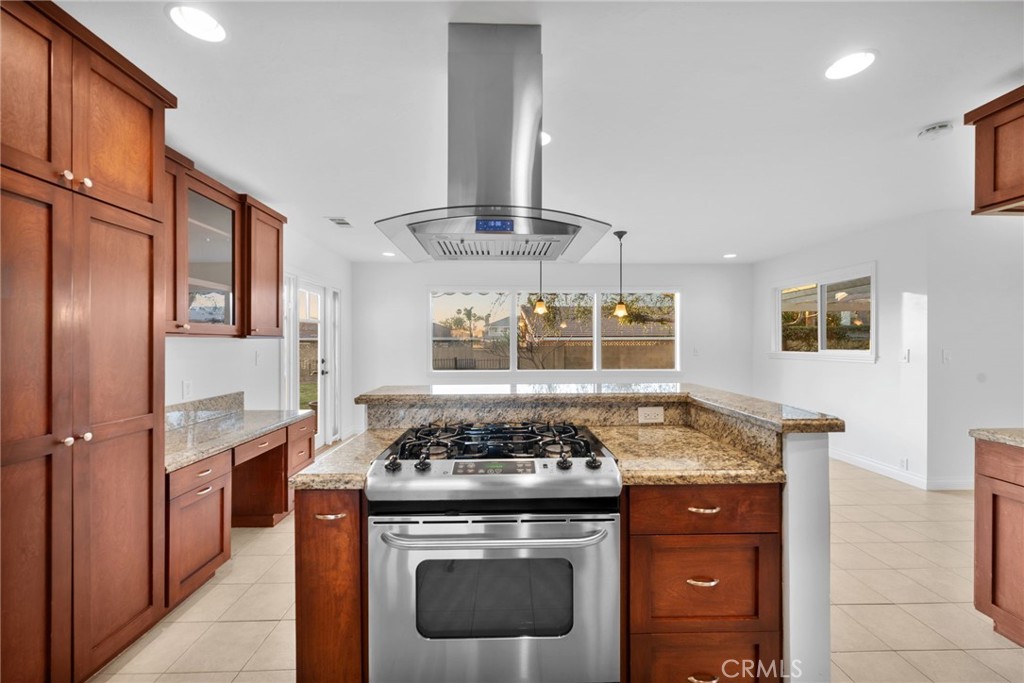 5251 Hamer Lane Placentia, CA 92870 - Photo 10 of 38 a kitchen with stainless steel appliances granite countertop a stove and a sink