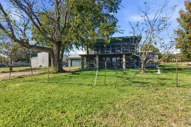 a house view with a play ground in front of it