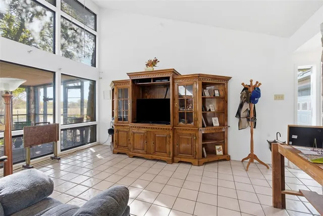 a living room with furniture and flat screen tv