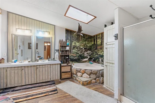 a view of a hallway and a livingroom with furniture