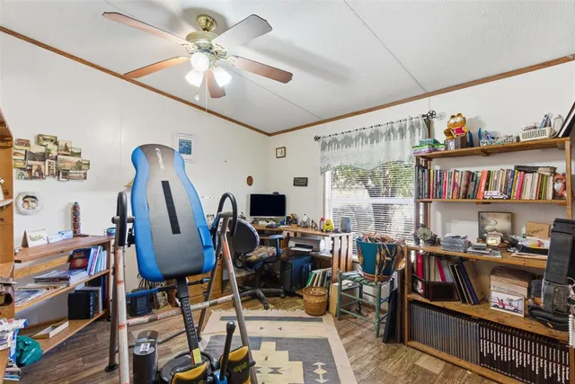 a view of a workspace with furniture and a living room