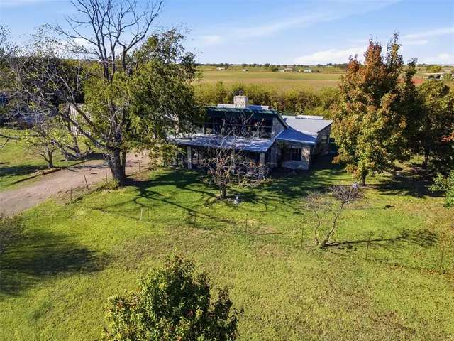a view of a lake with a house in the background