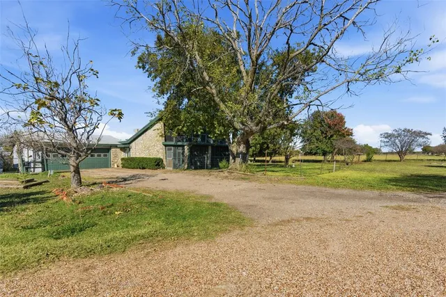 a view of a house with a big yard