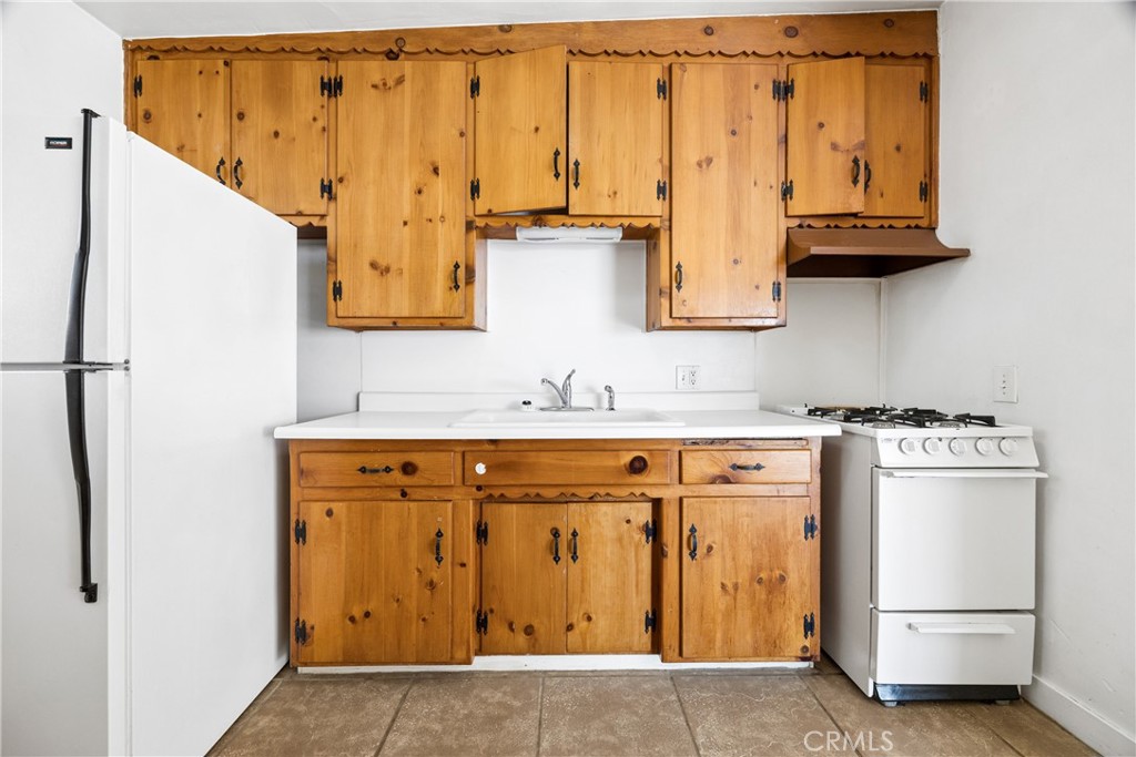 3437 Shearer Avenue Cayucos, CA 93430 - Photo 11 of 24 a bathroom with a granite countertop sink and a mirror