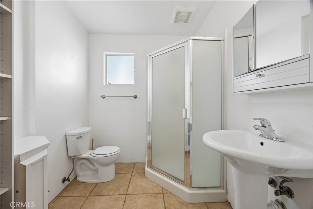 3437 Shearer Avenue Cayucos, CA 93430 - Photo 16 of 24 a bathroom with a sink toilet and shower