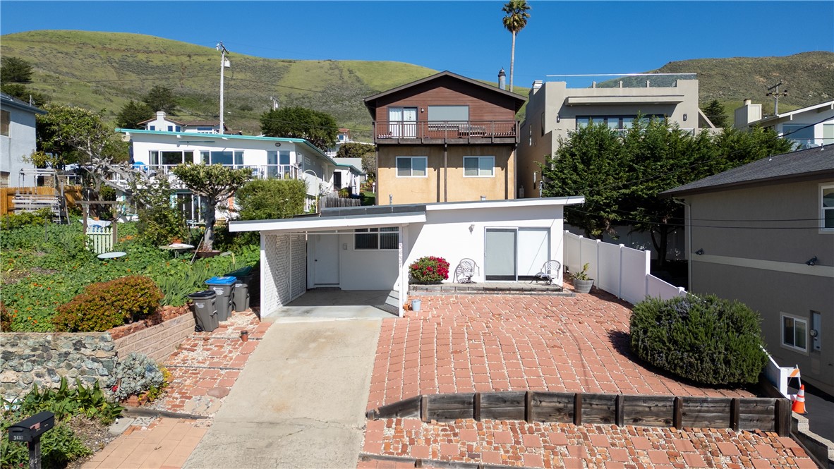 3437 Shearer Avenue Cayucos, CA 93430 - Photo 20 of 24 a view of a patio with a table and chairs and potted plants