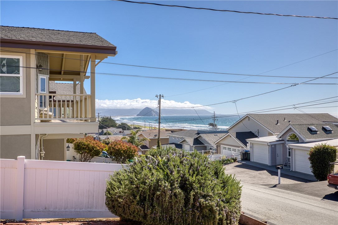 3437 Shearer Avenue Cayucos, CA 93430 - Photo 2 of 24 a front view of a house with garden