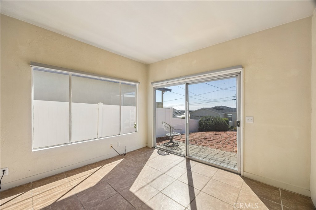 3437 Shearer Avenue Cayucos, CA 93430 - Photo 7 of 24 a bedroom with a bed and large window