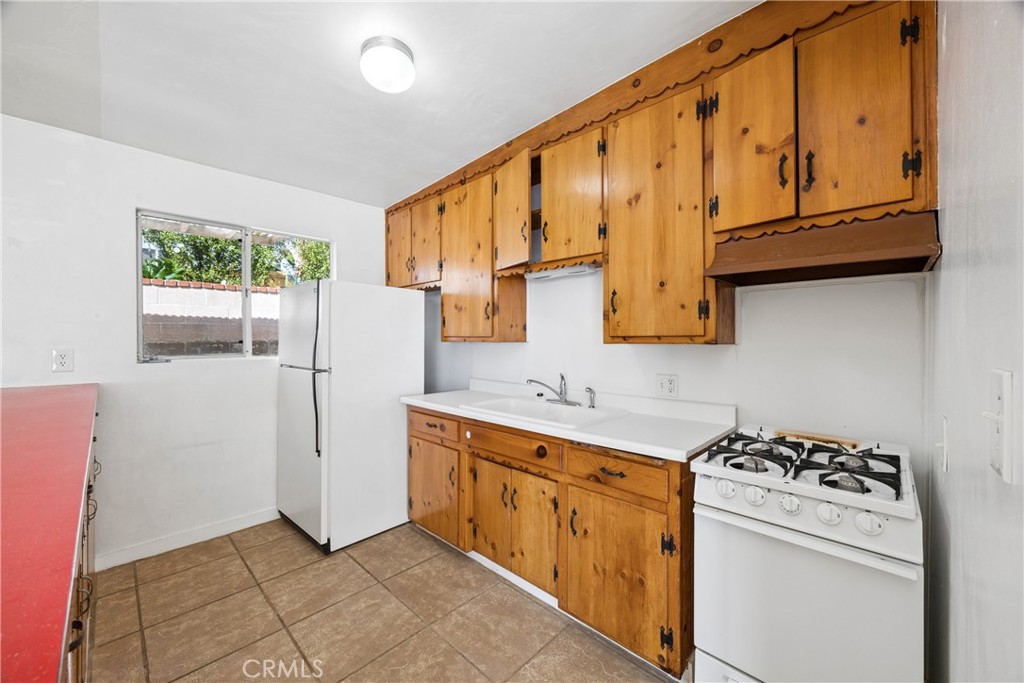 3437 Shearer Avenue Cayucos, CA 93430 - Photo 10 of 24 a kitchen with stainless steel appliances granite countertop a stove a refrigerator and a microwave
