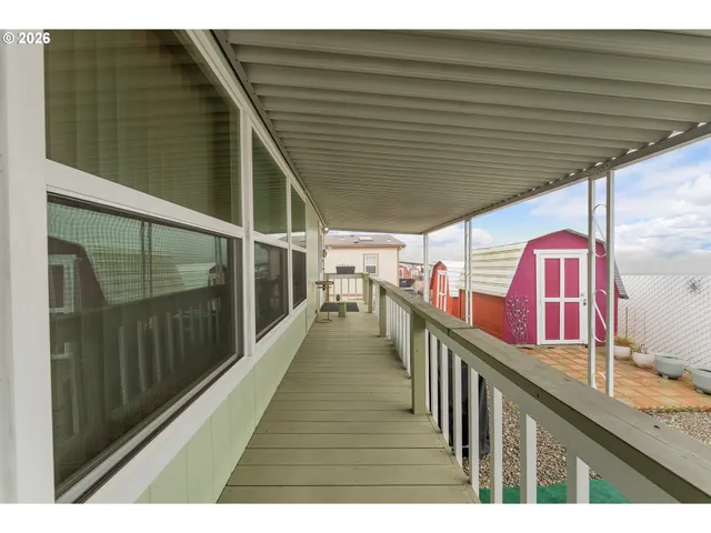 a view of house with backyard