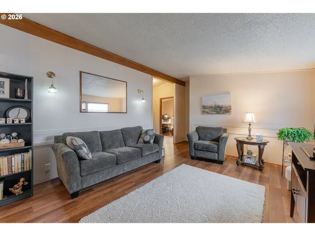 a living room with furniture and a table