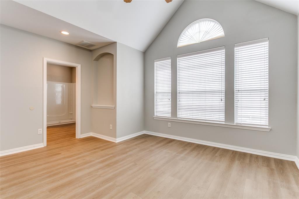 3725 Vienna Street Irving, TX 75038 - Photo 15 of 25 an empty room with wooden floor and windows