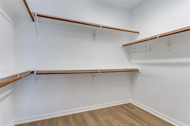 a view of a kitchen from a hallway