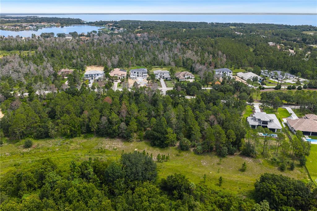 16015 Pendio Drive Montverde, FL 34756 - Photo 3 of 11 a view of a lake with mountains in the background