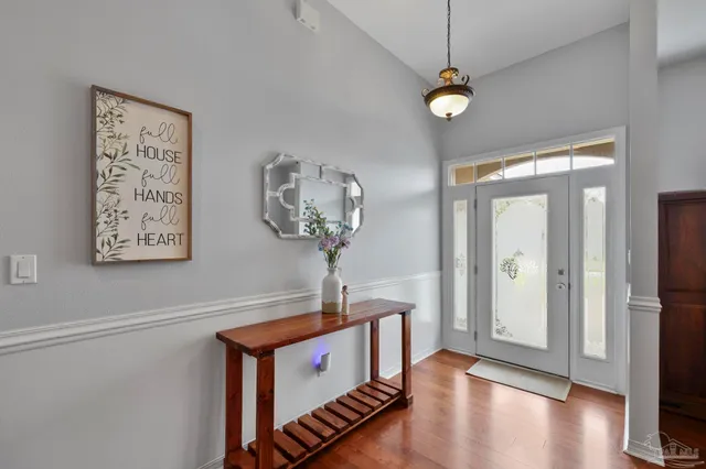 a view of a kitchen with a dining table & chairs