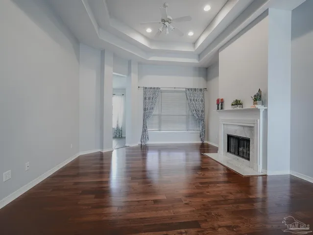 a kitchen with stainless steel appliances a sink a stove a microwave a sink and a refrigerator