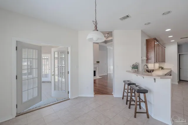 a white bath tub sitting next to a white sink
