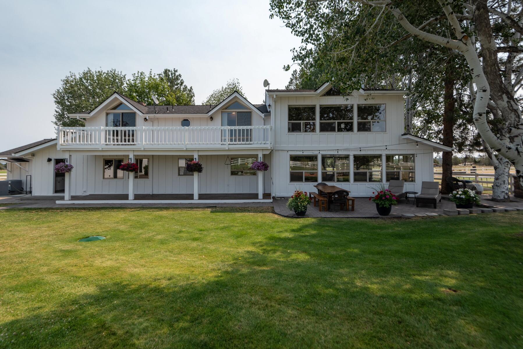 64495 Research Road Bend, OR 97703 - Photo 35 of 54 a front view of a house with garden