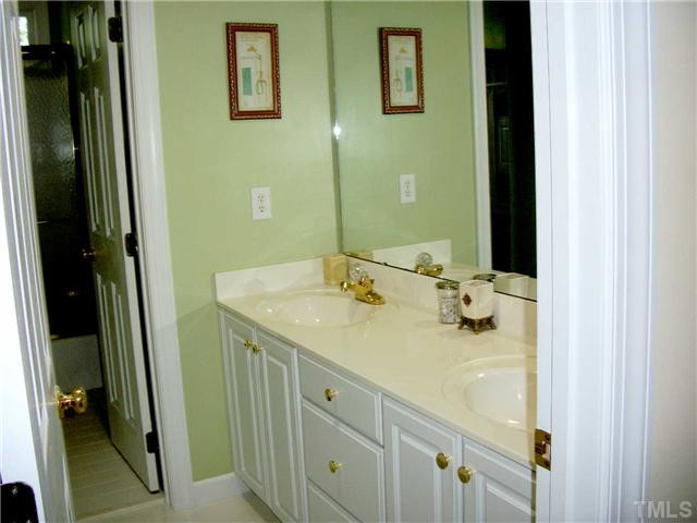 5209 Coffee Tree Drive Raleigh, NC 27613 - Photo 15 of 25 Hall Bath has double sinks, solar tube, and separate toilet/shower area Other