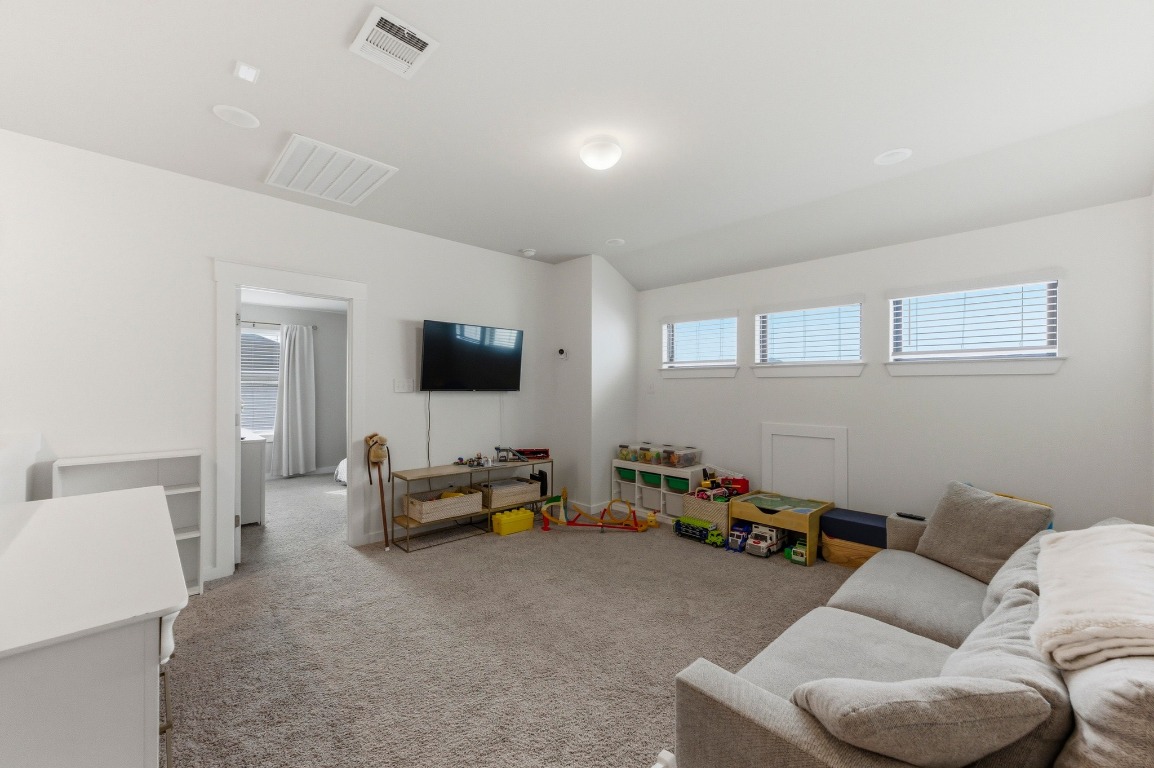 159 Threshing Road, Unit A Buda, TX 78610 - Photo 20 of 33 View of carpeted living area